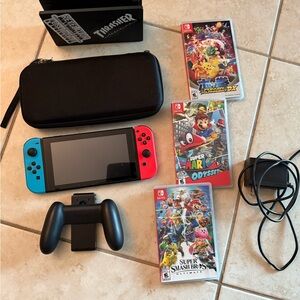 Complete Nintendo Switch system with Red and Blue Joy-Con Controllers